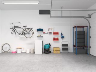Clean and modern custom garage setup with bike mount, wall tool organizers, and tire storage rack in Chandler, AZ